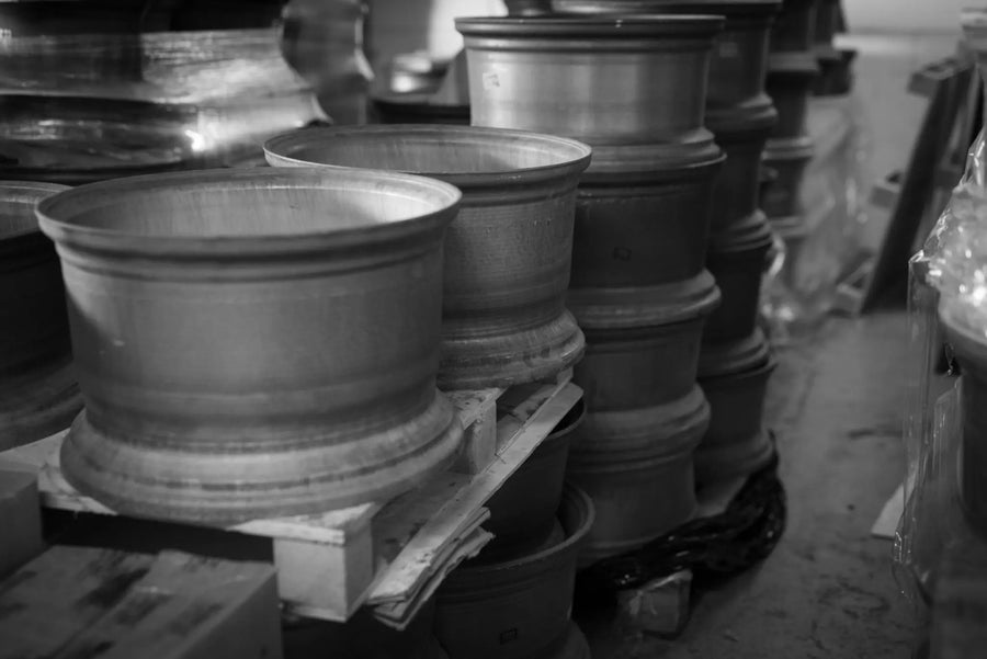 Raw forged aluminium blanks on the rack before machining, in the workshop PB Forged wheels are cut in