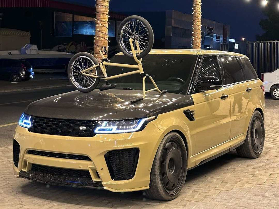 Range Rover Sport SVR in sand with a carbon bonnet, on black off road forged wheels